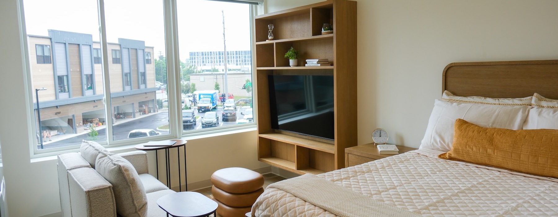 a bedroom with a bed and a tv