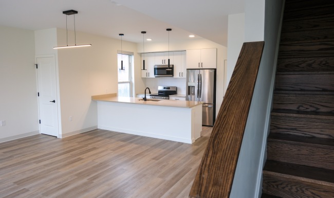 an empty kitchen and living room