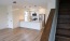 an empty kitchen and living room