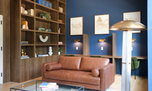 a community library room with a couch and chairs