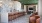 a clubroom with an island, chairs and a pool table