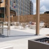 a courtyard area with couches, chairs and tables