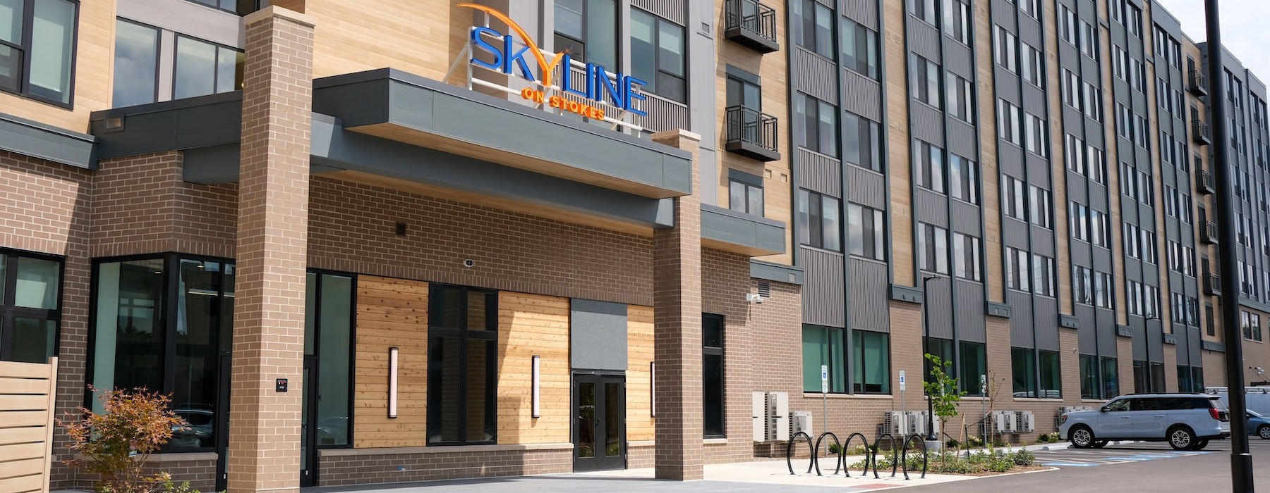 the entrance of a building with a large sign