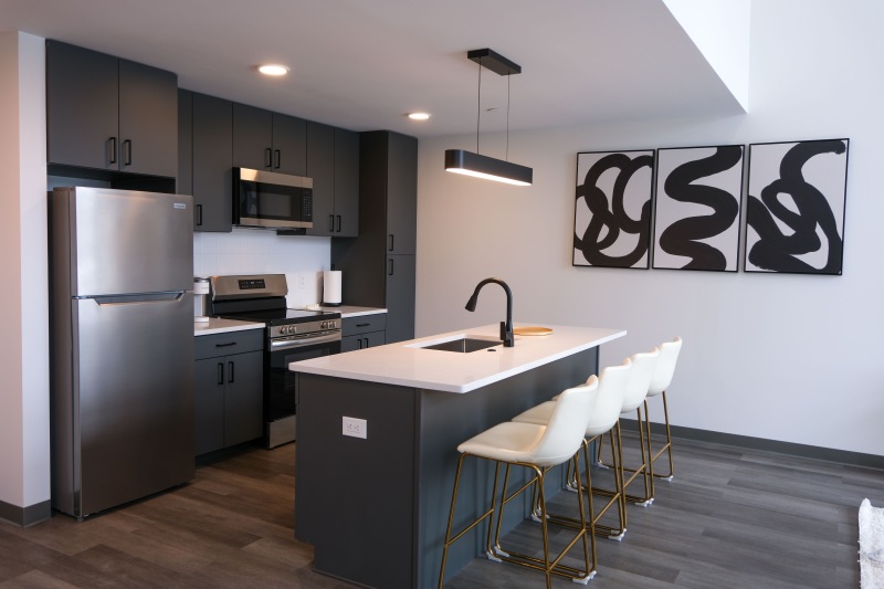 a kitchen with a table and chairs